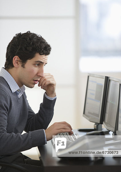 Business man using computer in office