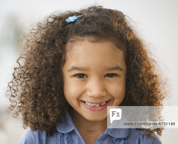 USA  New Jersey  Jersey City  portrait of smiling girl (6-7) with afro