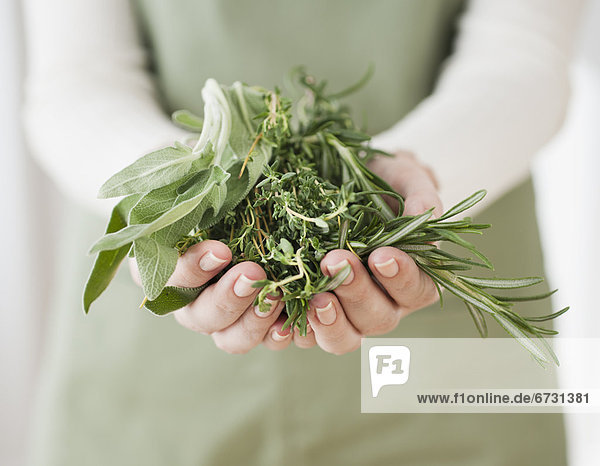Woman holding herbs