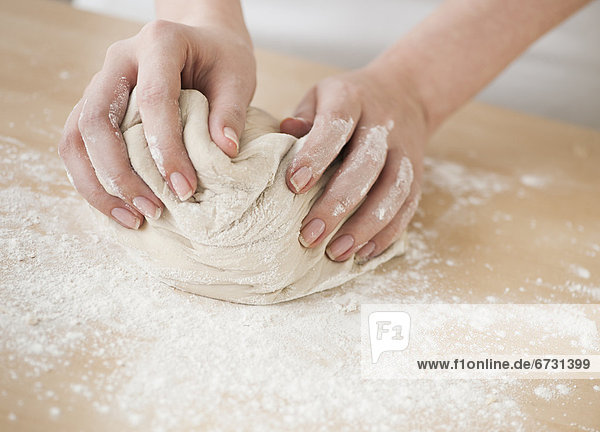 Woman preparing dough