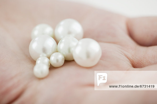 Woman holding pearl