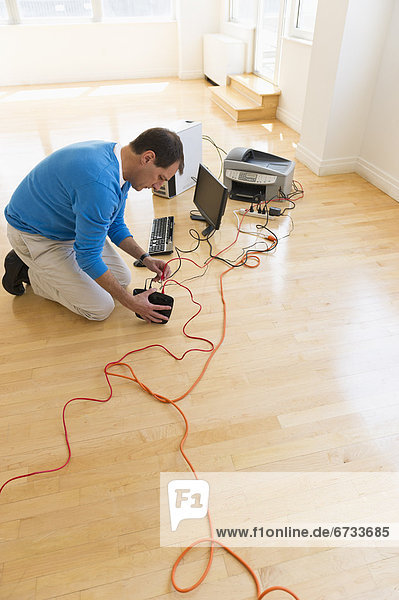 Businessman setting up internet in new office