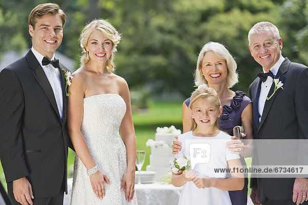 Portrait of married couple  parents and flower girl (10-11)
