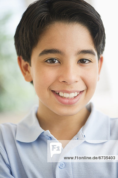 Portrait of smiling boy (12-13)