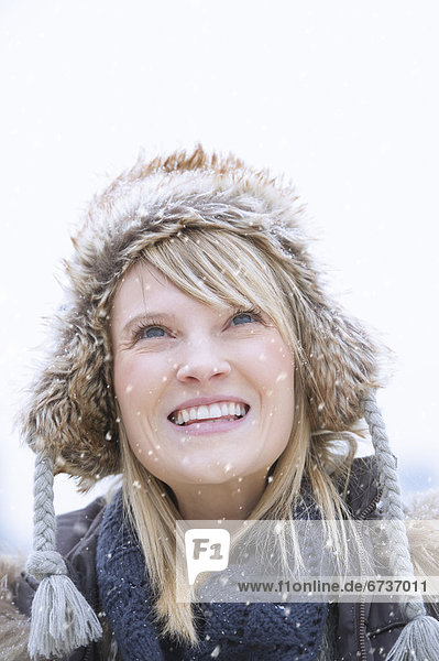 Portrait of woman wearing knit hat smiling