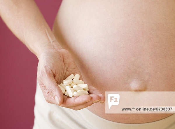 Frau  halten  Schwangerschaft  Vitamin  handvoll