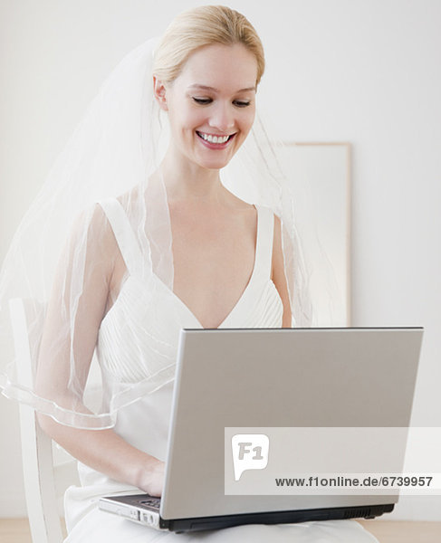 Young bride surfing on internet