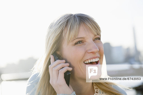USA  Brooklyn  Williamsburg  Portrait of blonde woman talking on mobile phone
