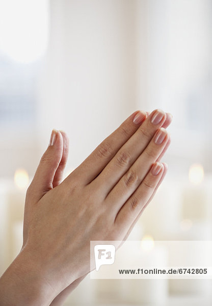 Woman praying  close-up of hands