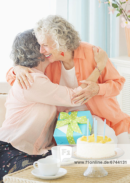 Two senior women celebrating birthday