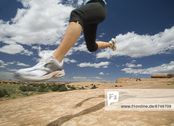 Woman jumping in desert