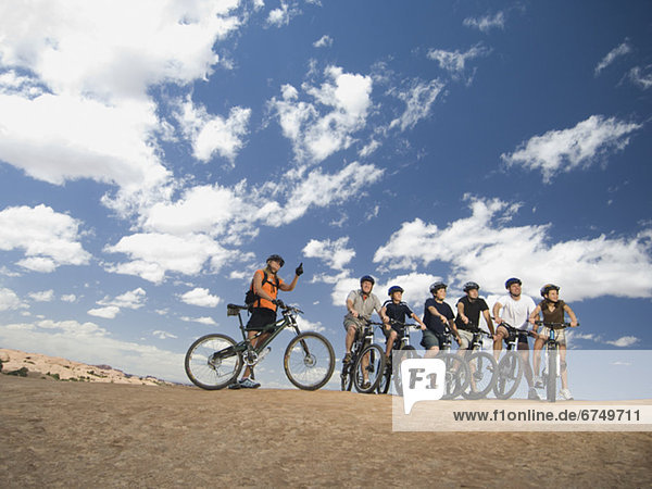 Group of cyclists in desert