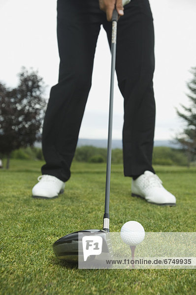 Close up of man playing golf