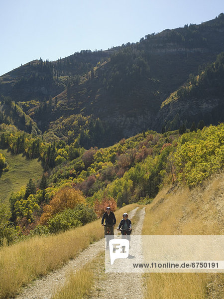 Senior couple riding mountain bikes  Utah  United States