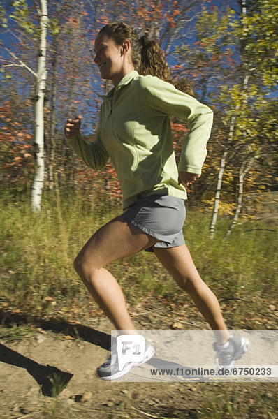 Woman jogging on trail  Utah  United States