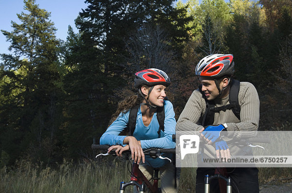Couple on mountain bikes  Utah  United States