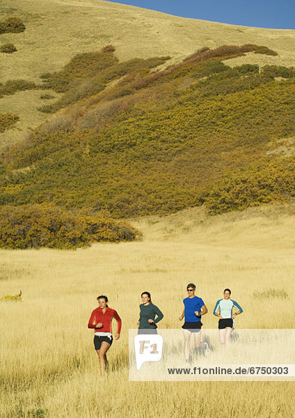 Group of people running in field  Salt Flats  Utah  United States