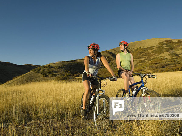 Two women on mountain bikes  Salt Flats  Utah  United States