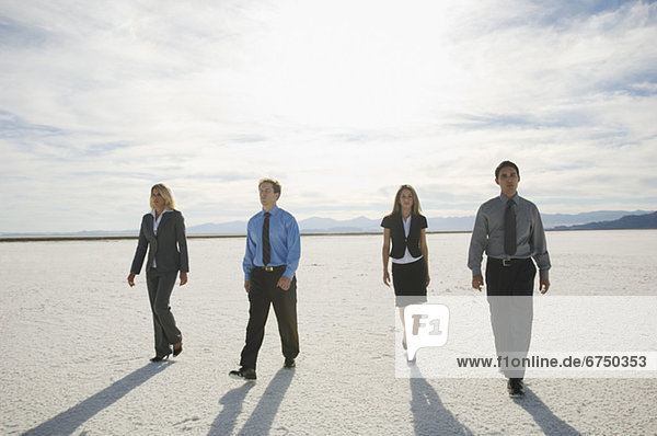 Businesspeople walking on salt flats  Salt Flats  Utah  United States