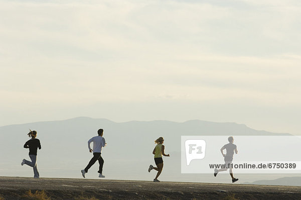 Group of people running on road  Utah  United States