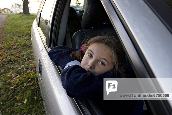 Young Girl Looking out of Car Window