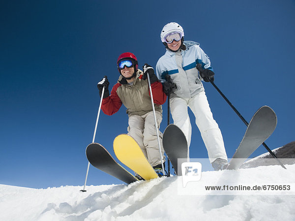 Couple standing on skis