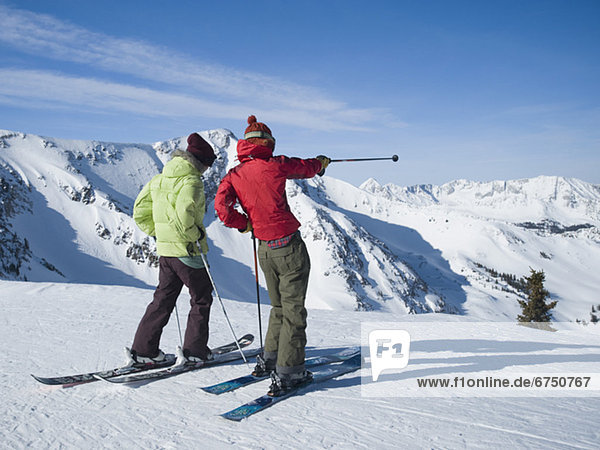 Women standing on skis  Wasatch Mountains  Utah  United States