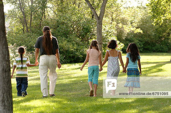 Family Walking in Park
