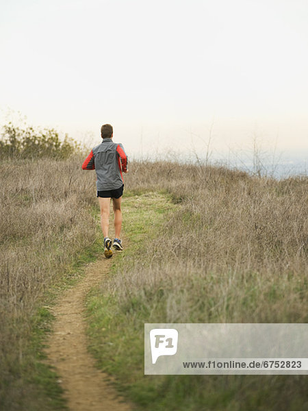 Person running on trail