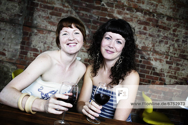 Female Friends having Drinks at Bar