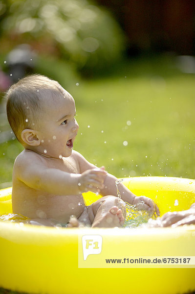 Baby Boy in Inflatable Pool