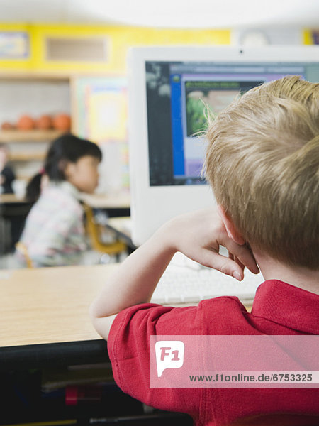 Elementary students working on computers