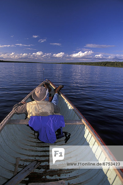 Man Relaxing in Canoe  Sutton Lake  Northern Ontario
