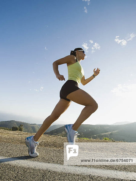 Runner training on a road in Malibu