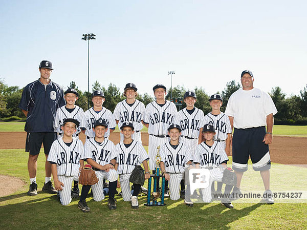 USA  California  Ladera Ranch  portrait of little league players (aged 10-11)