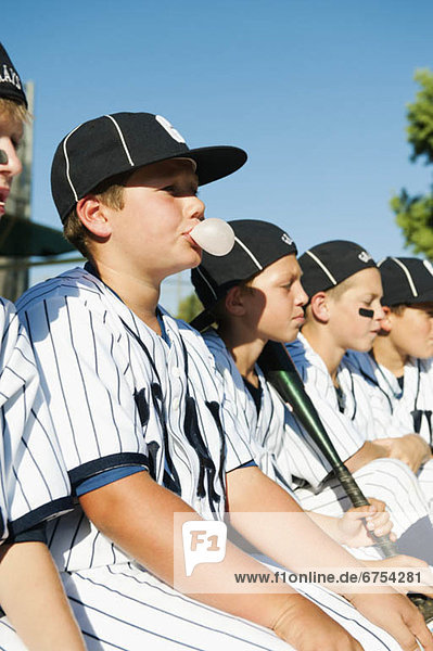 USA  California  Ladera Ranch  Boys (10-11) from little league sitting on dugout