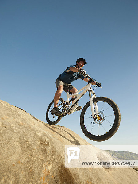 USA  California  Laguna Beach  Mountain biker riding downhill