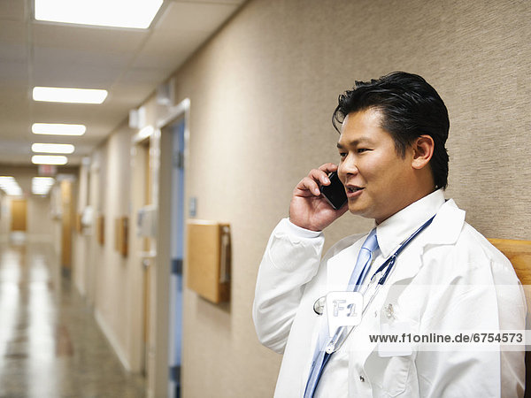 Portrait of doctor talking on mobile phone