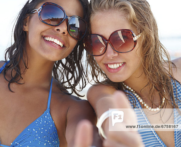 Portrait of young women posing on beach