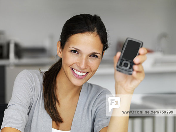 Woman holding cellular phone
