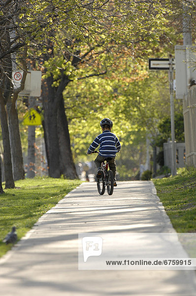 Young Boy Riding Bicycle  Toronto  Ontario