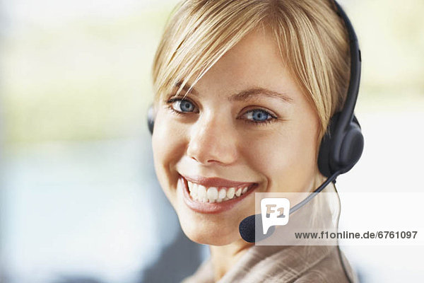 Portrait of young female customer service representative