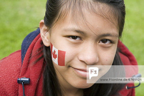 Close up of a Girl with Maple Leaf Tattoo on her Cheek  Vancouver  British Columbia