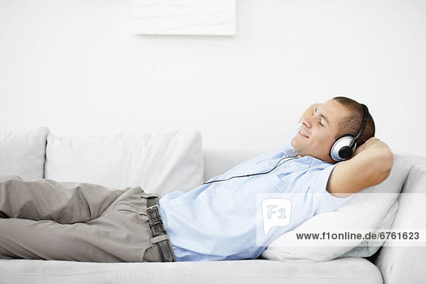 South Africa  Man relaxing while listening music