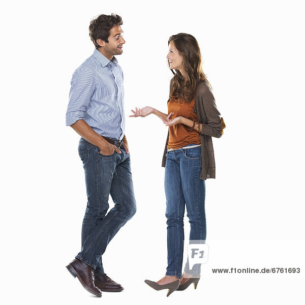 Studio shot of young couple having discussion