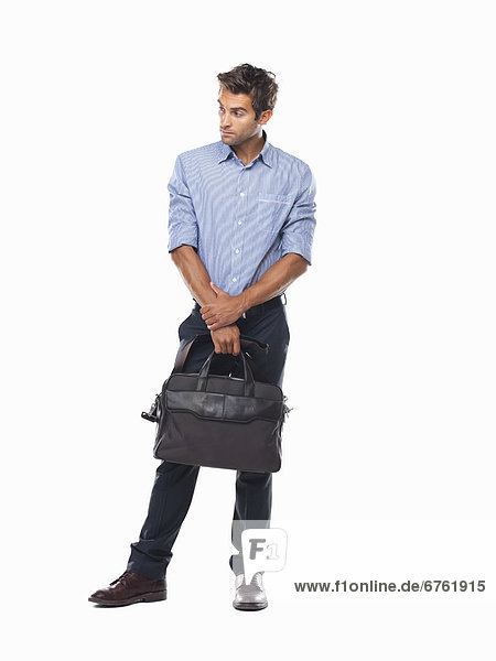 Studio shot of executive holding business bag
