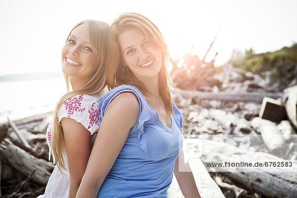 Portrait of two young women on beach