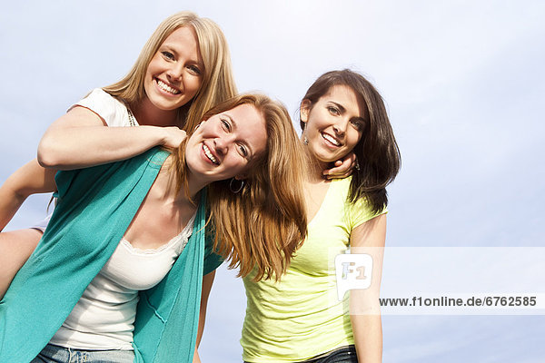 Portrait of three young women hanging out