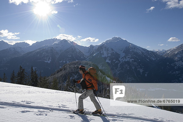 Skier Heading up Cloudburst Mountain  Coast Mountains  British Columbia