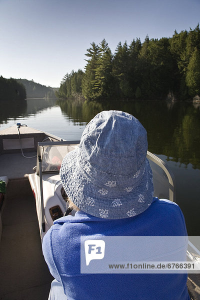 Woman boating in Algonquin Park  Ontario
